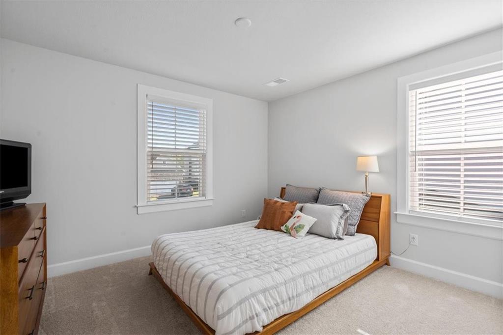 345 Crest Lane Mars, PA 16046 - Photo 34 of 42 a large bed sitting in a bedroom next to a window