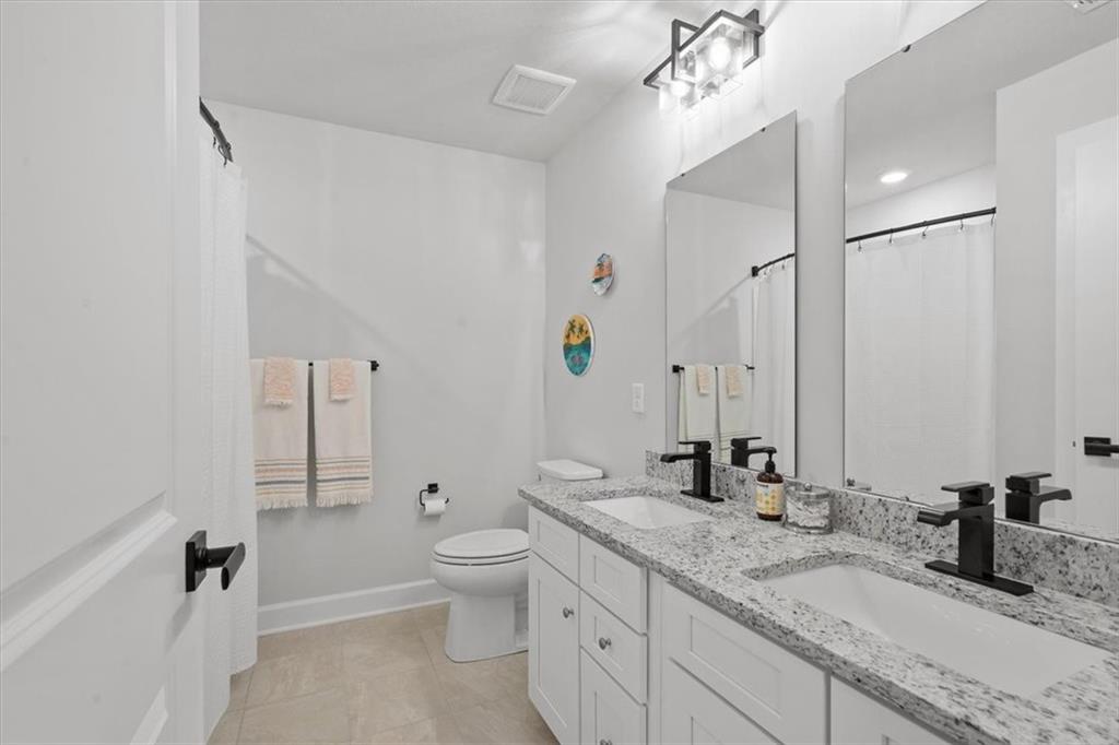 345 Crest Lane Mars, PA 16046 - Photo 35 of 42 a bathroom with a granite countertop sink a toilet and bathtub
