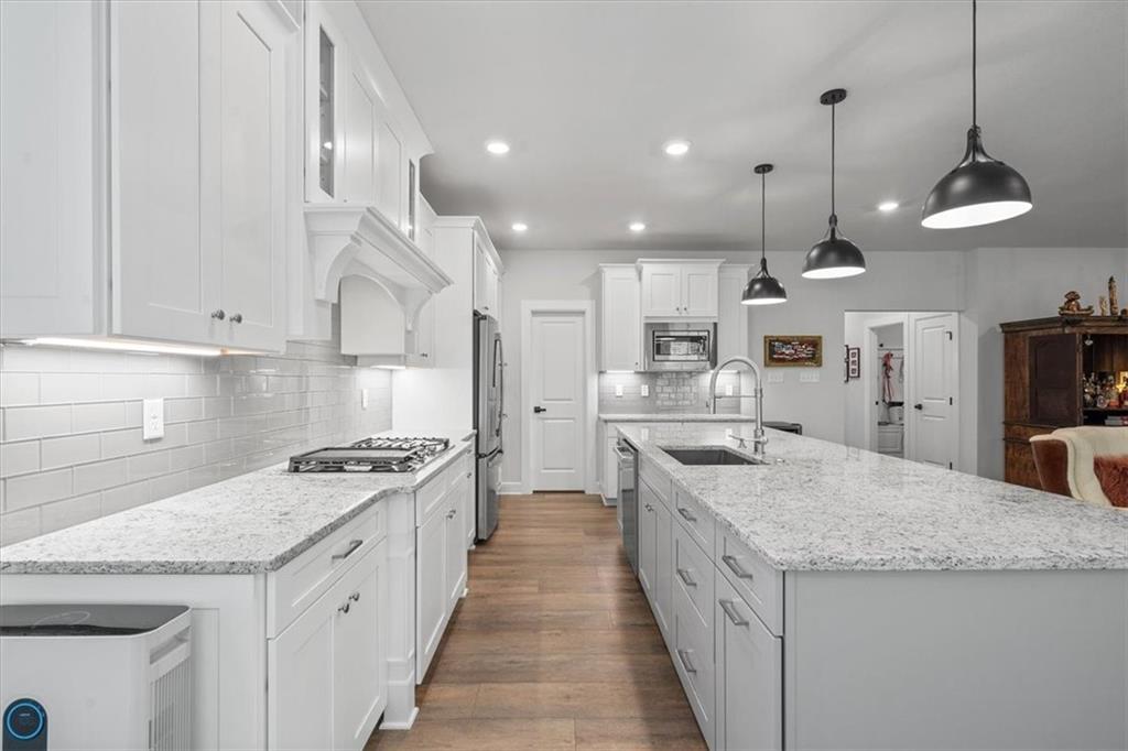 345 Crest Lane Mars, PA 16046 - Photo 5 of 42 a large kitchen with stainless steel appliances granite countertop a stove and a sink