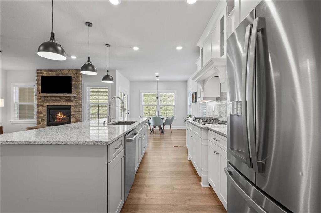 345 Crest Lane Mars, PA 16046 - Photo 6 of 42 a kitchen with stainless steel appliances granite countertop a refrigerator a stove a sink and a microwave