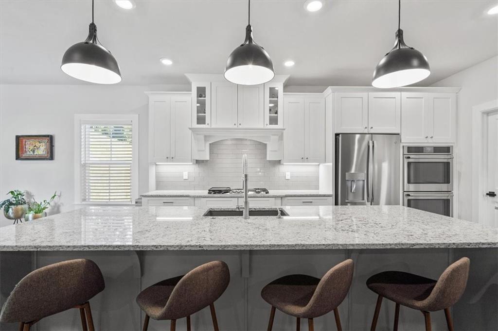 345 Crest Lane Mars, PA 16046 - Photo 7 of 42 a kitchen with granite countertop white cabinets and stainless steel appliances