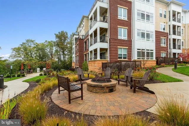a swimming pool with outdoor seating and yard