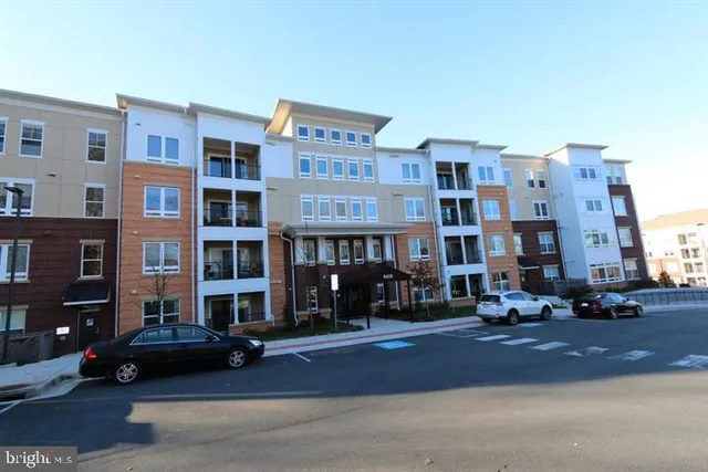 a city street lined with buildings and cars