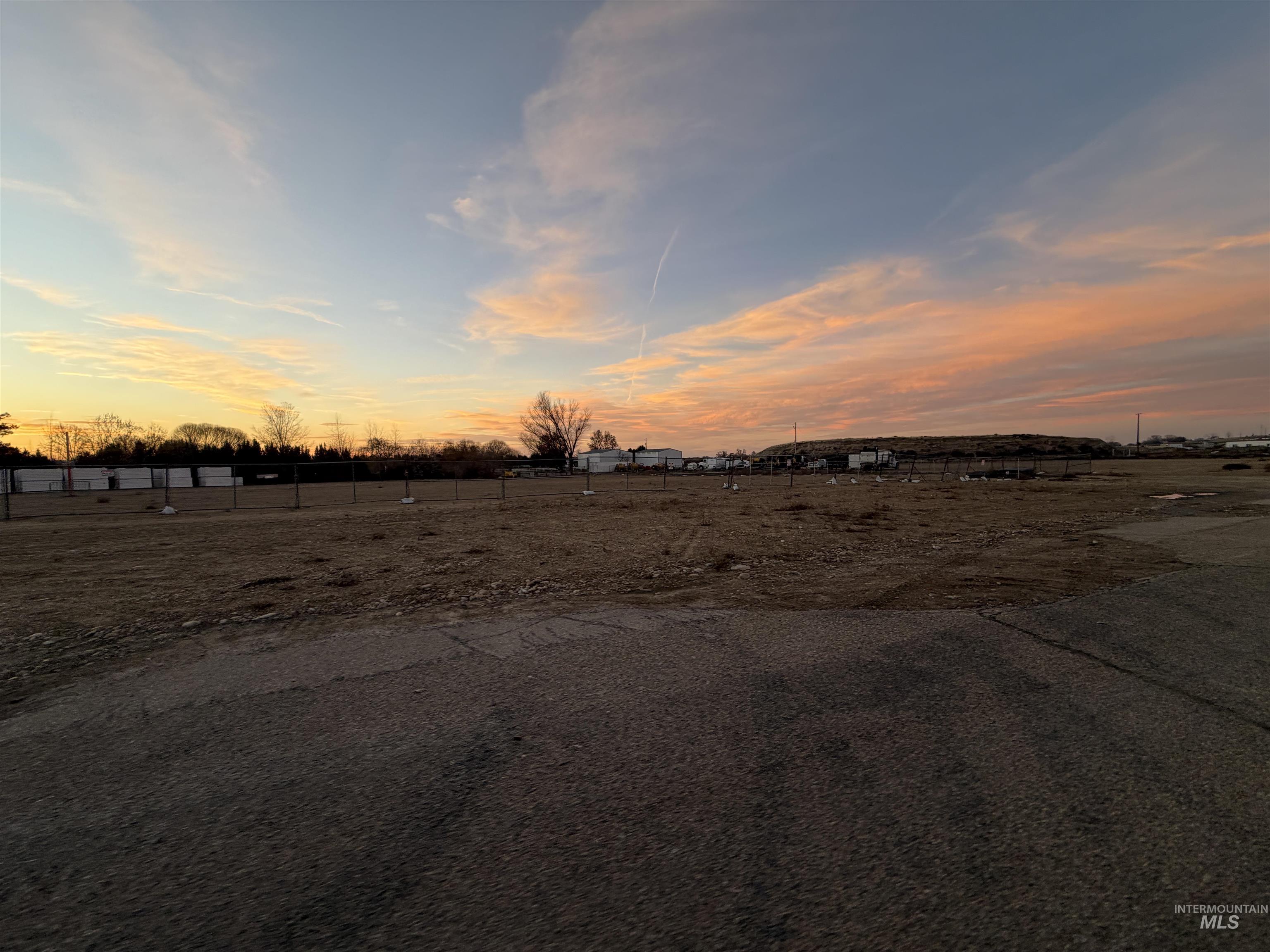 21677 Chicago Street Caldwell, ID 83607 - Photo 16 of 16 Yard at dusk featuring a view of countryside