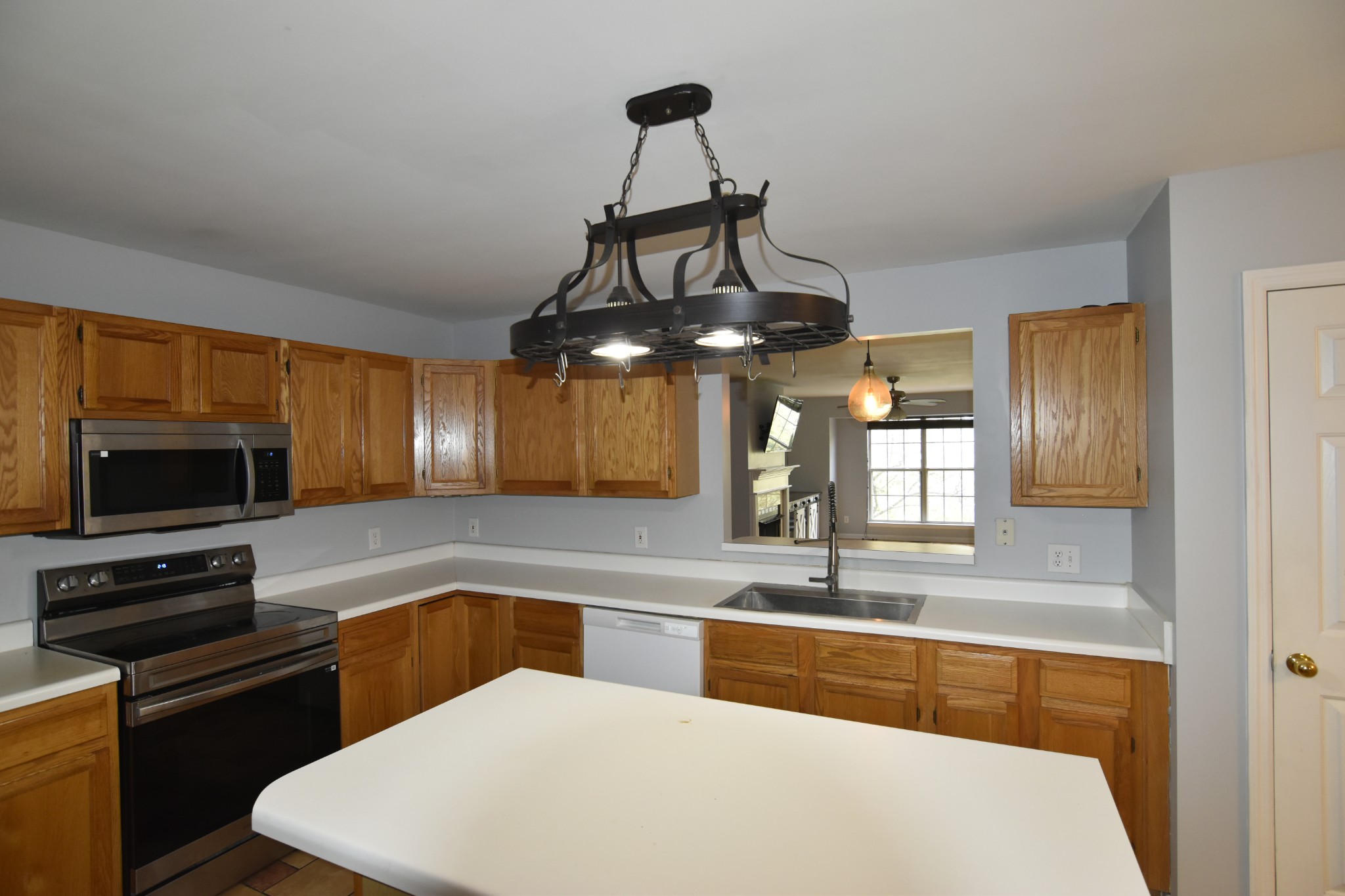 515 Huntington Ridge Drive Nashville, TN 37211 - Photo 16 of 42 a kitchen with stainless steel appliances a stove a sink and a microwave