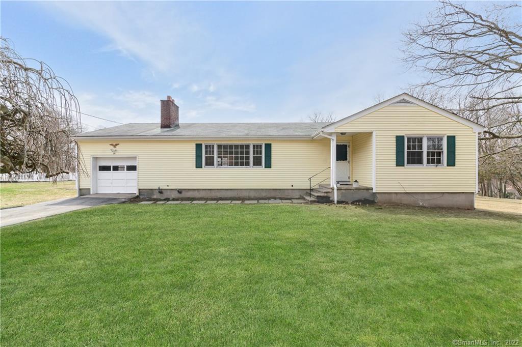 181 West Rocks Road Norwalk, CT 06851 - Photo 1 of 1 a front view of a house with a garden