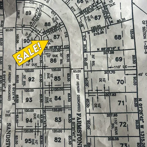 a view of a building with parking space