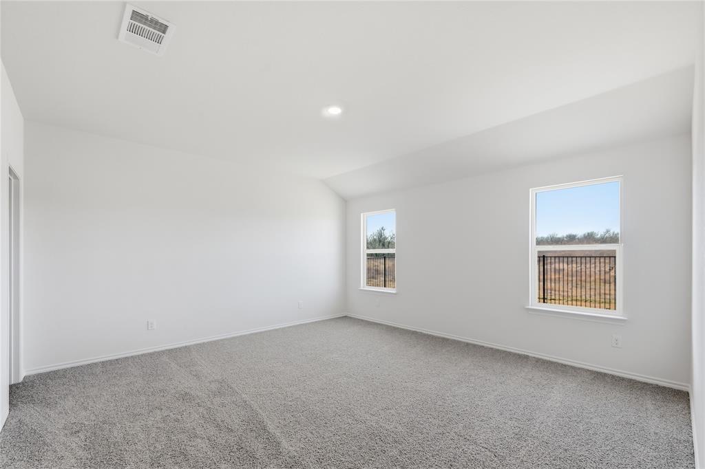 1917 Reveille Way Terrell, TX 75160 - Photo 5 of 6 Spacious interior room featuring light gray carpeting and white painted walls