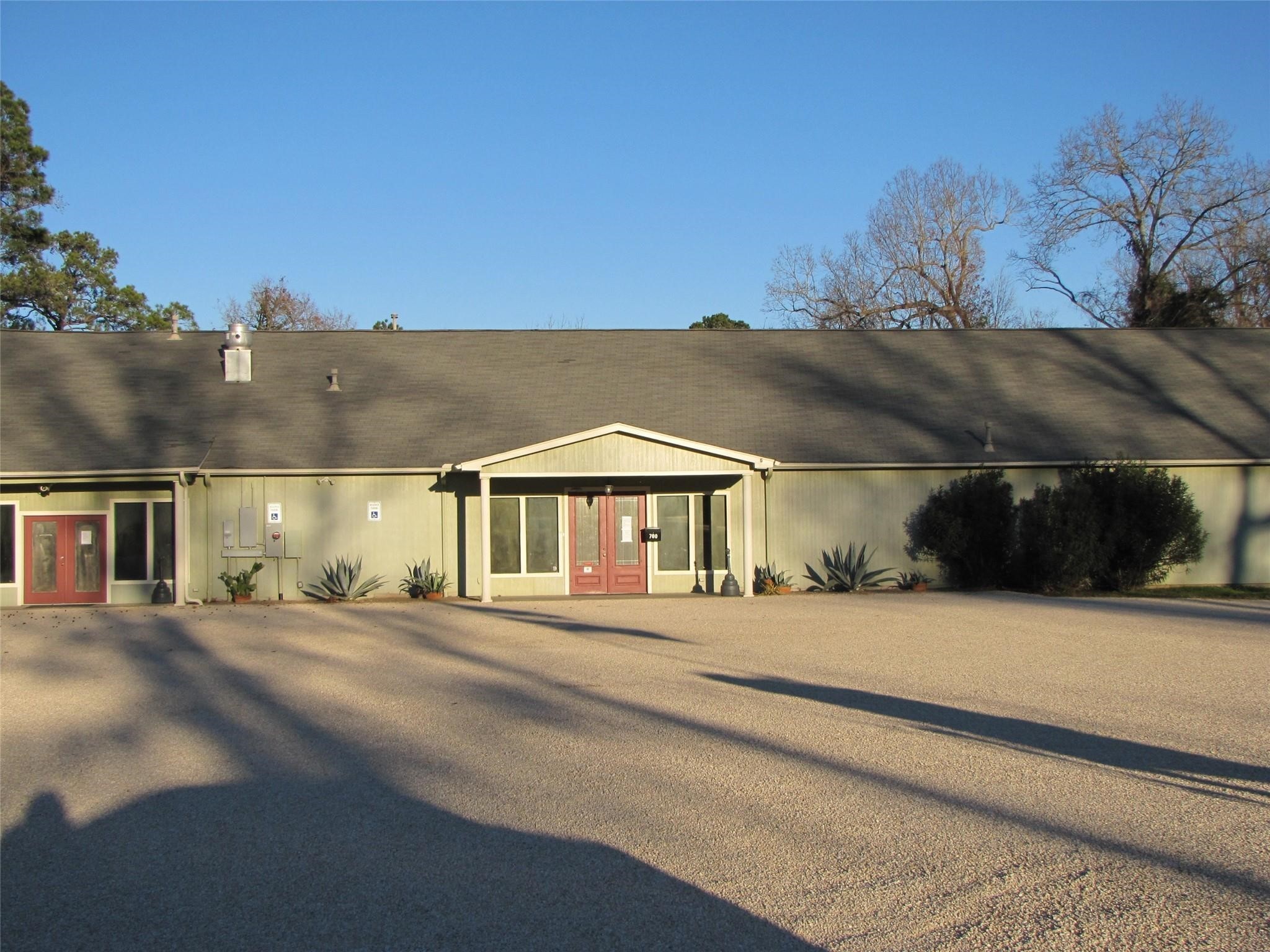 661 Lagoon Drive Point Blank, TX 77364 - Photo 12 of 14 a front view of a house with a yard