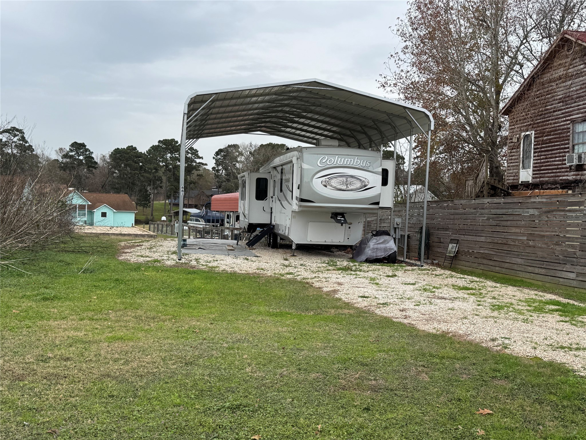 661 Lagoon Drive Point Blank, TX 77364 - Photo 2 of 14 a view of a car park in front of a house