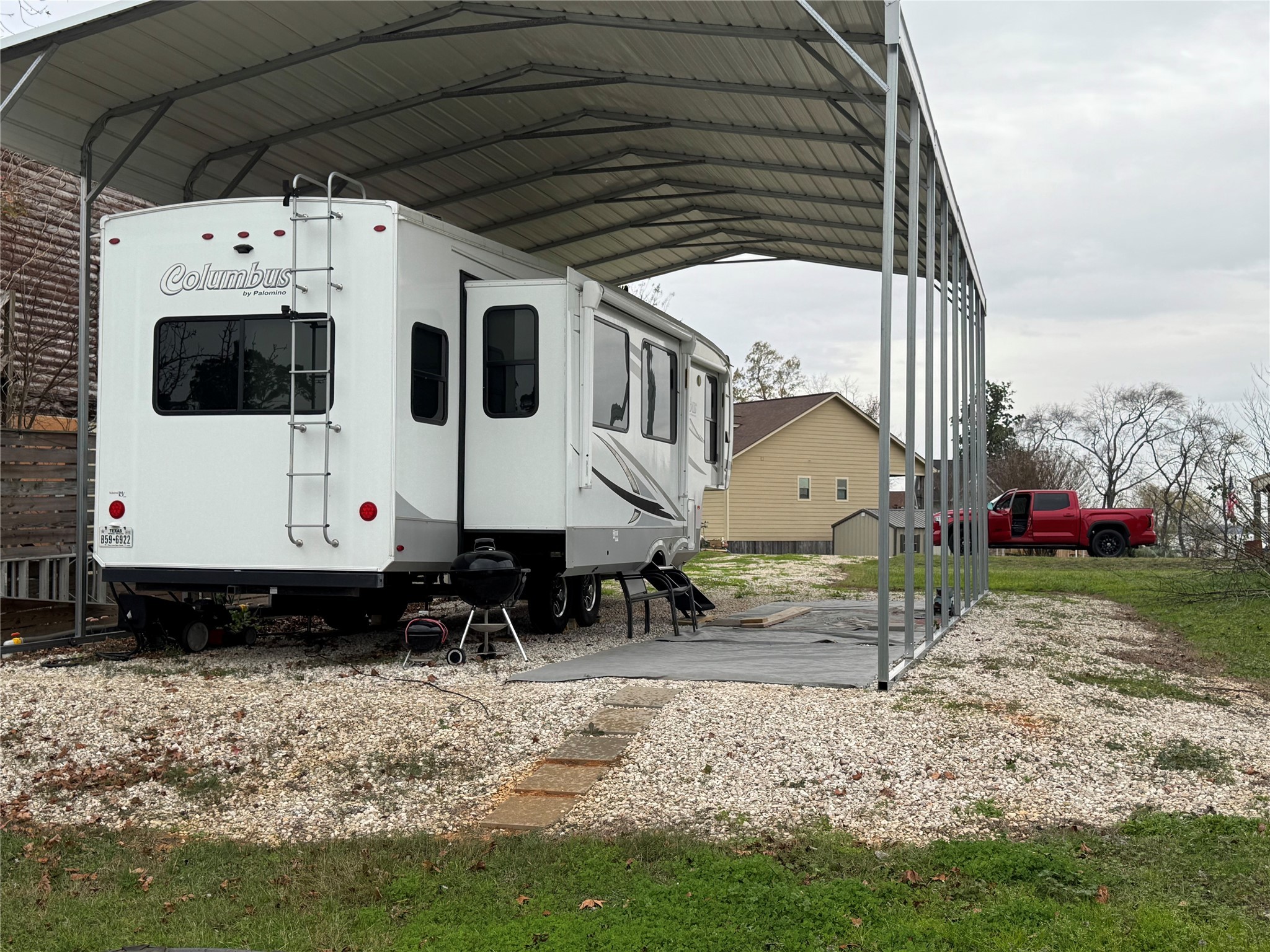 661 Lagoon Drive Point Blank, TX 77364 - Photo 5 of 14 a view of a white house with a yard