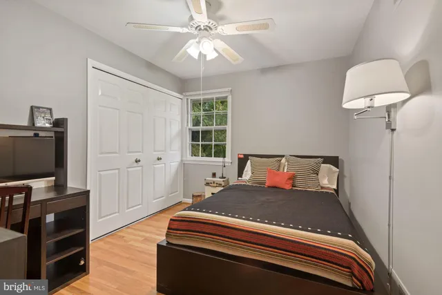 a bedroom with furniture and a flat screen tv