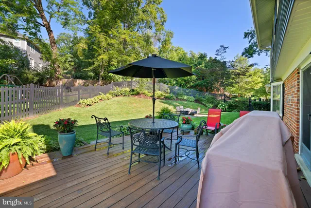 a view of a table and chairs under an umbrella in patio