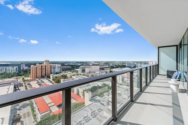a living room with furniture a lamp and a table