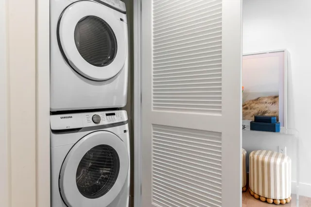 a view of a workspace with furniture and wooden floor