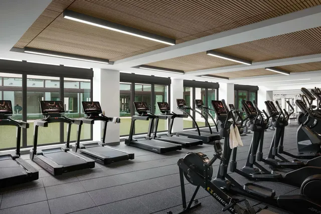 a view of a workspace with furniture and wooden floor
