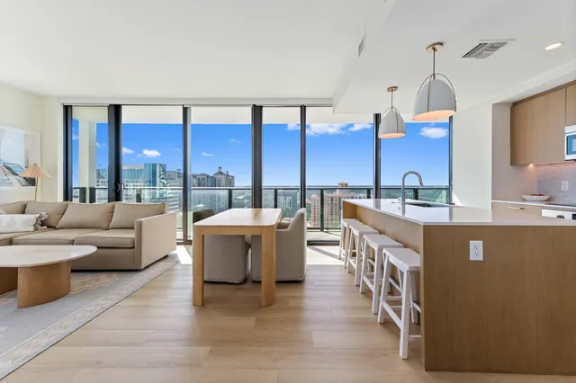 a living room with couches a coffee table and chairs