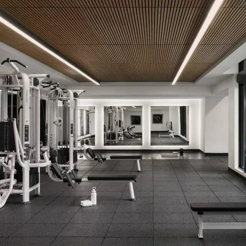 a very nice looking room with wooden floor and furniture