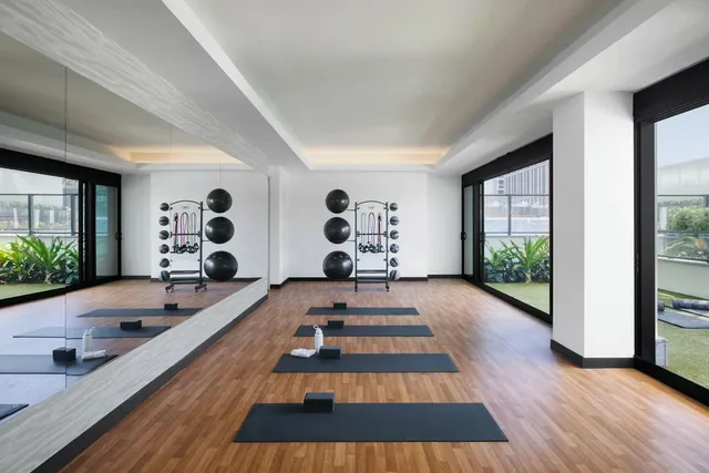 a view of a patio with table and chairs and potted plants