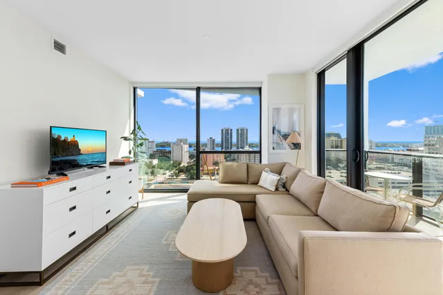a living room with furniture and a flat screen tv