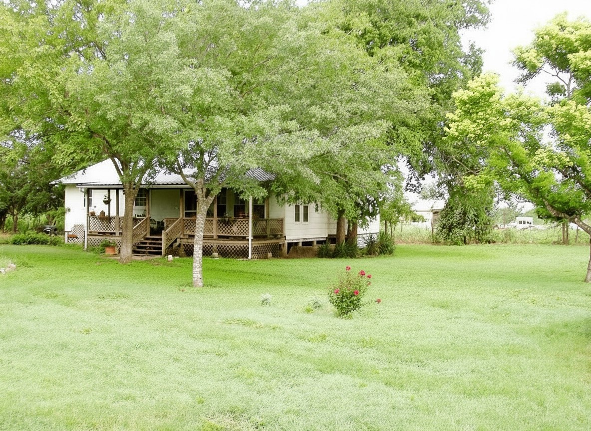 11913 McAngus Road Del Valle, TX 78617 - Photo 2 of 45 a front view of a house with a yard and trees