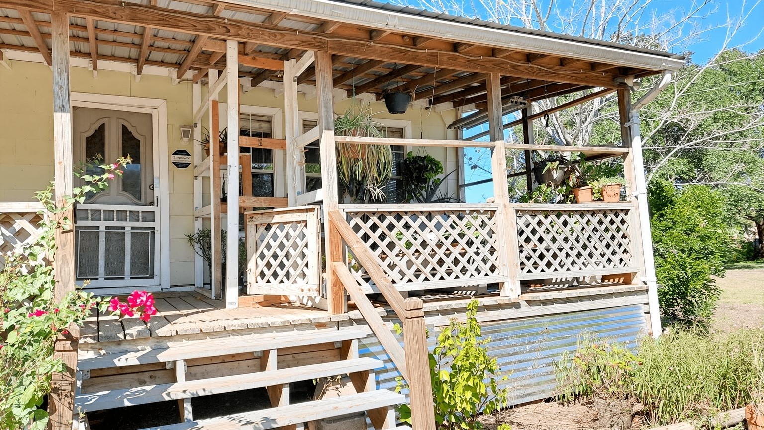 11913 McAngus Road Del Valle, TX 78617 - Photo 23 of 45 a side view of a house with a porch