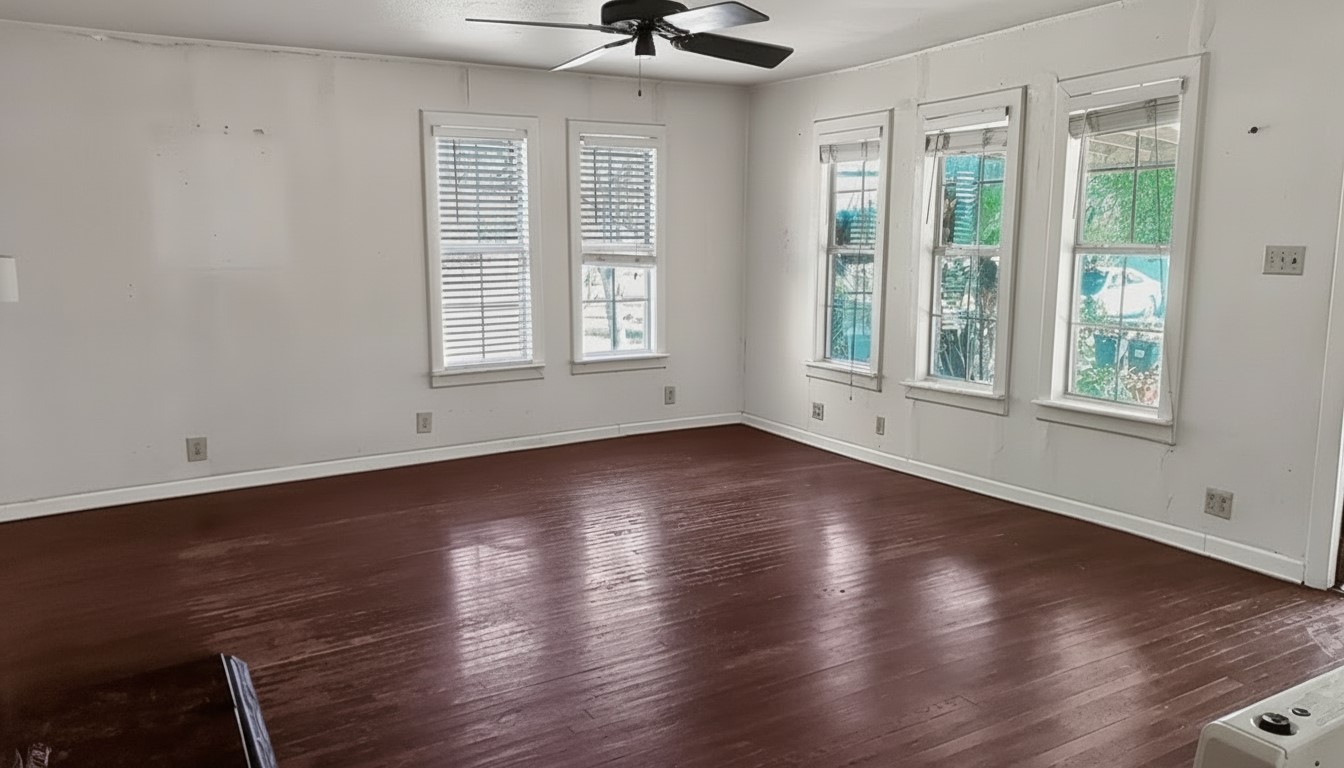 11913 McAngus Road Del Valle, TX 78617 - Photo 26 of 45 a view of an empty room with wooden floor and a window