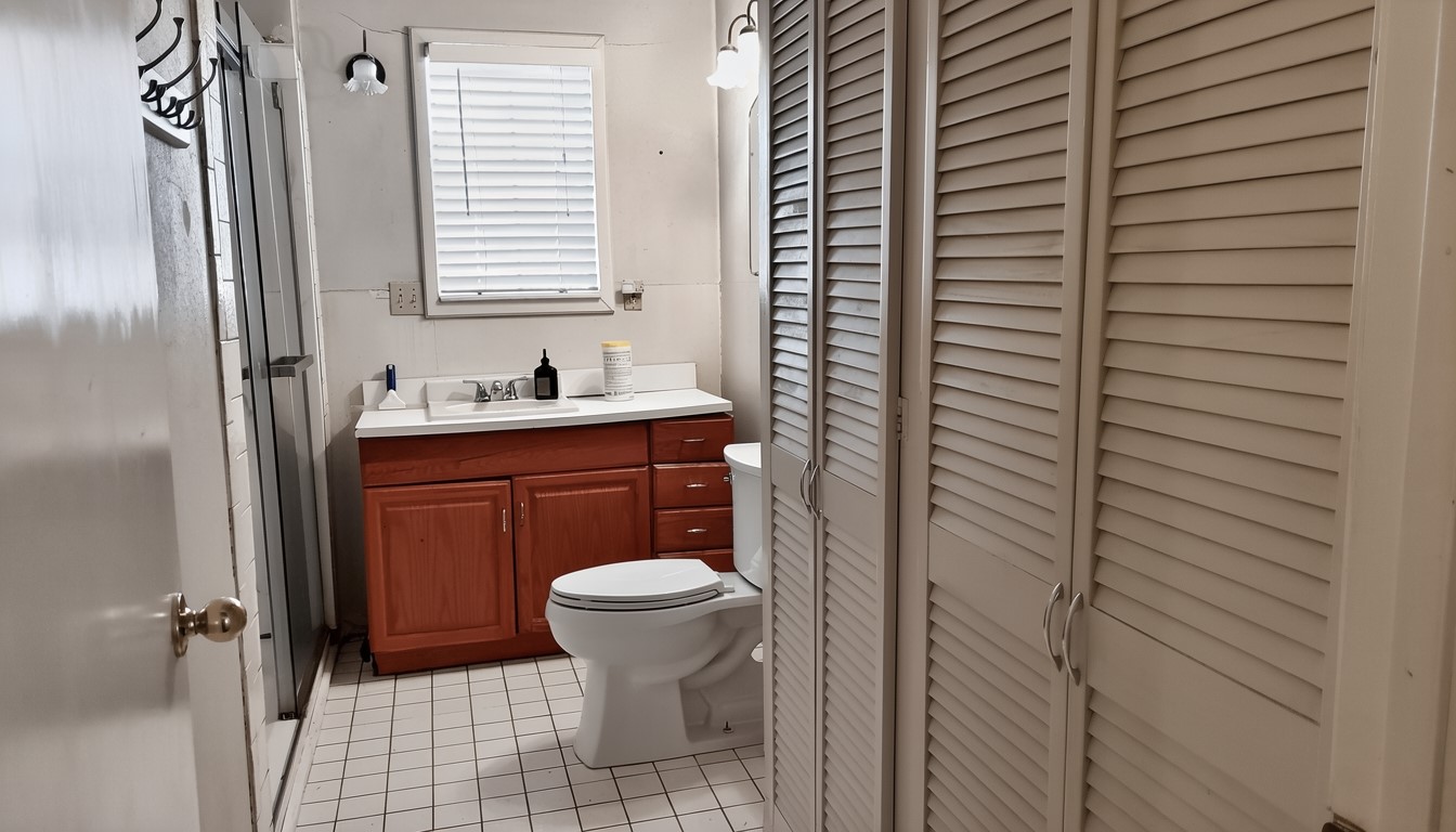 11913 McAngus Road Del Valle, TX 78617 - Photo 30 of 45 a bathroom with a sink toilet and shower