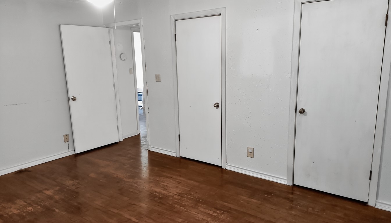 11913 McAngus Road Del Valle, TX 78617 - Photo 33 of 45 a view of an empty room with wooden floor