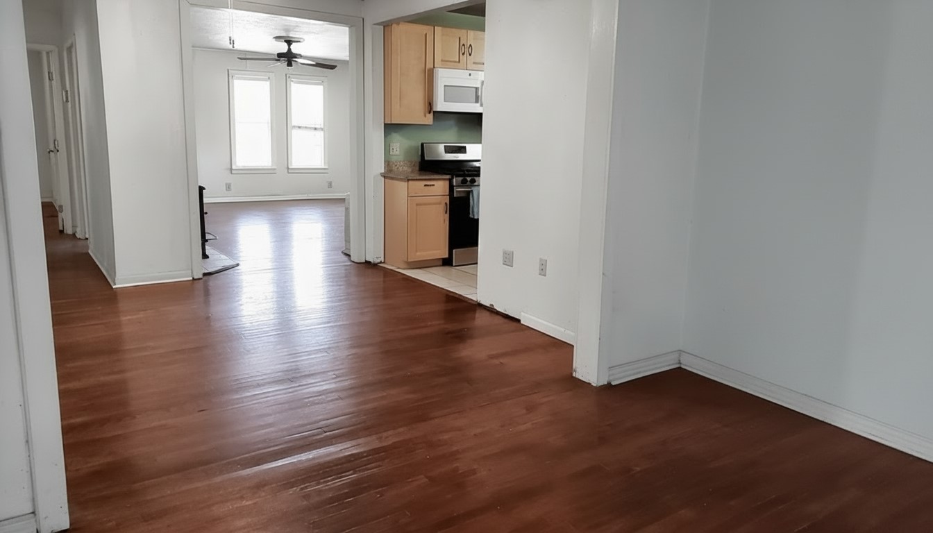 11913 McAngus Road Del Valle, TX 78617 - Photo 36 of 45 a view of a kitchen with wooden floor and a window