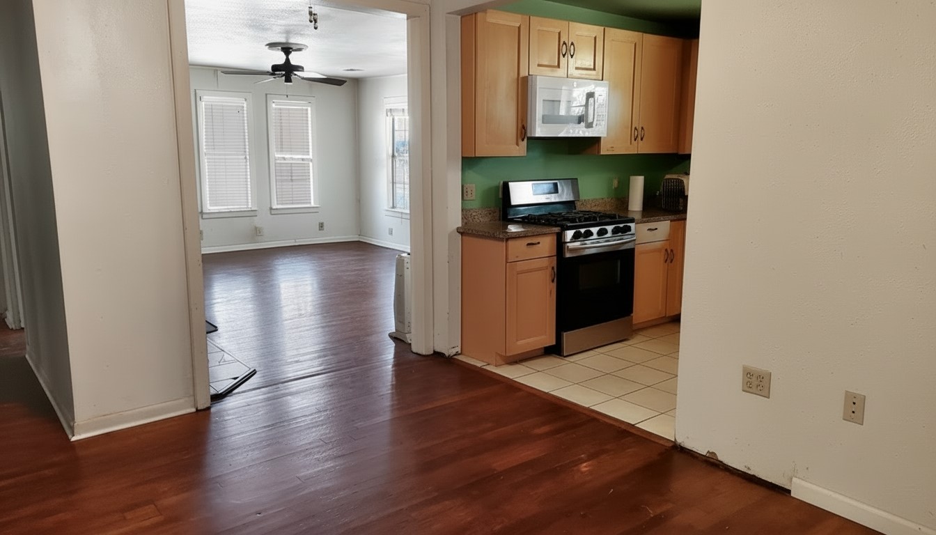 11913 McAngus Road Del Valle, TX 78617 - Photo 37 of 45 a view of a kitchen from the hallway