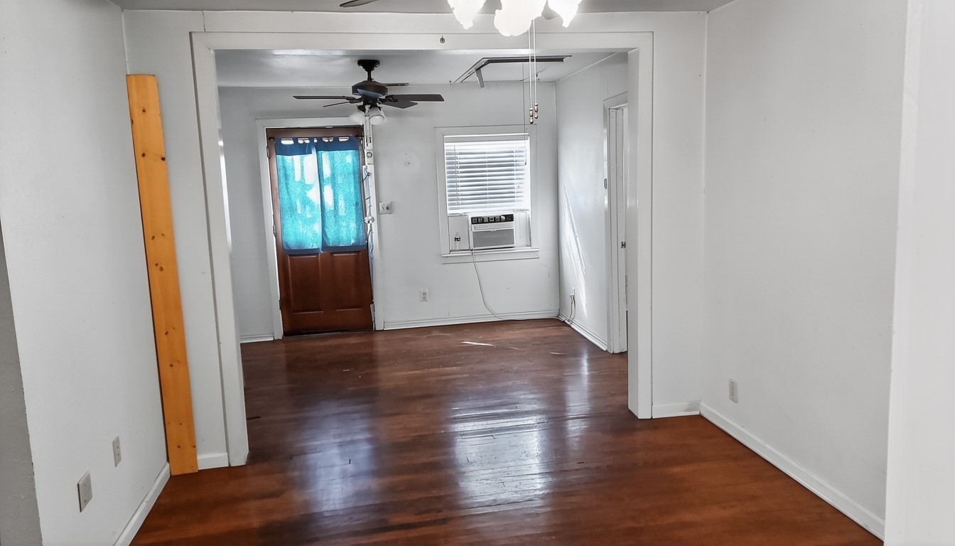 11913 McAngus Road Del Valle, TX 78617 - Photo 41 of 45 wooden floor in an empty room with a window