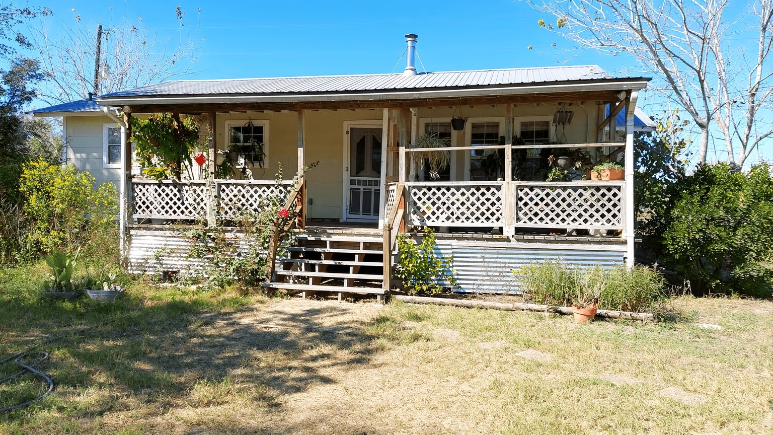 11913 McAngus Road Del Valle, TX 78617 - Photo 45 of 45 a front view of a house with garden