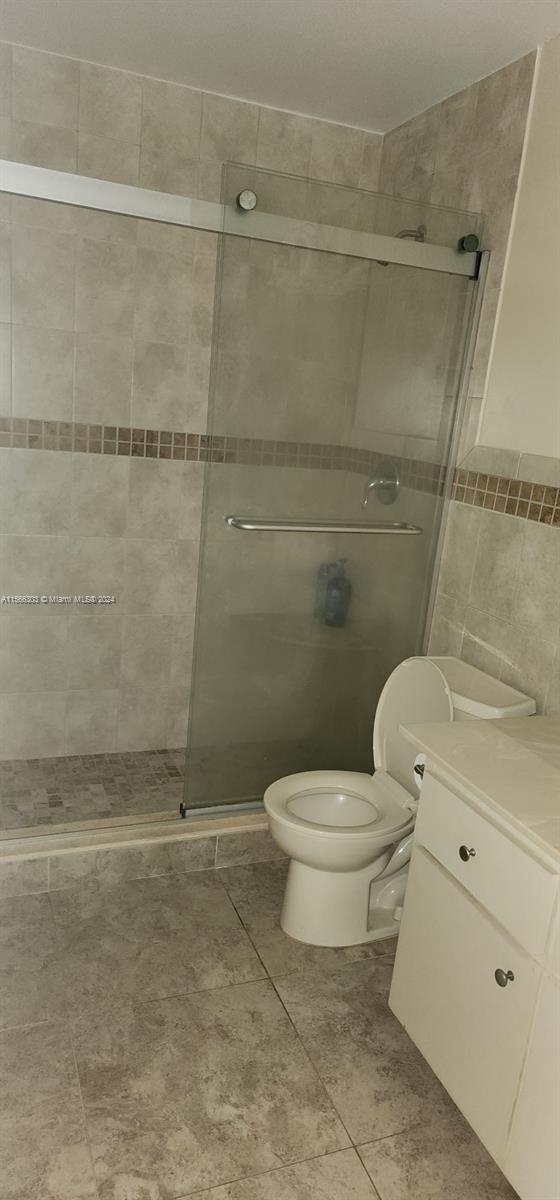 1501 Northwest 13th Street, Unit 15 Boca Raton, FL 33486 - Photo 10 of 14 a bathroom with a toilet and a shower