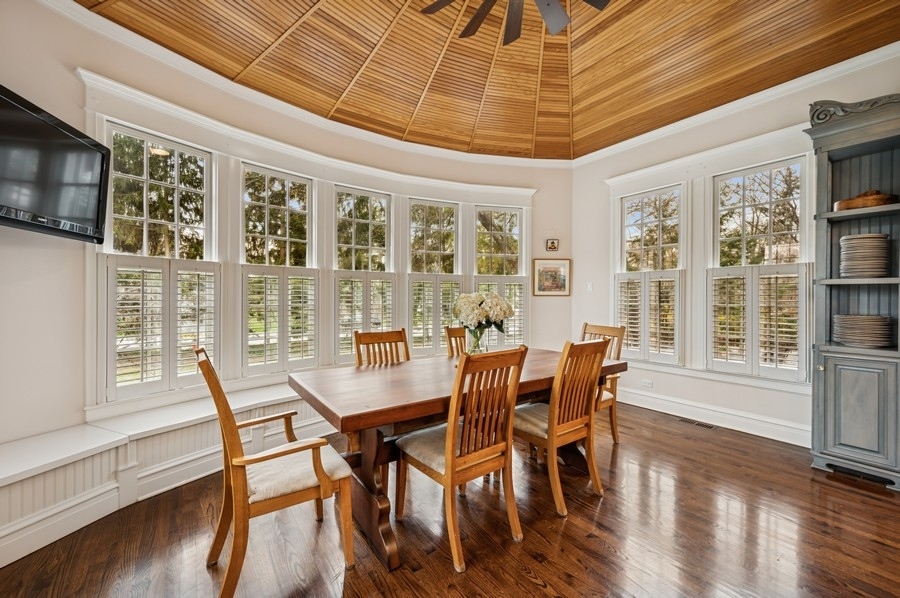 1025 Mohawk Road Wilmette, IL 60091 - Photo 12 of 47 a view of a dining room with furniture window and wooden floor