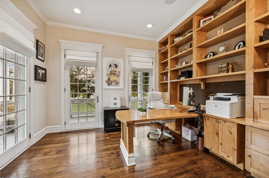1025 Mohawk Road Wilmette, IL 60091 - Photo 16 of 47 a view of a workspace with furniture and a bookshelf