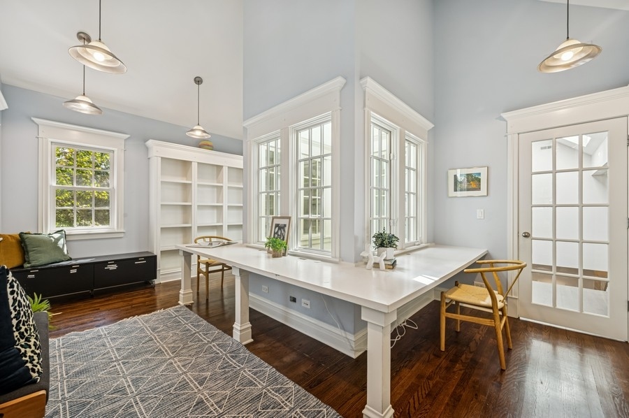1025 Mohawk Road Wilmette, IL 60091 - Photo 28 of 47 a room with a table chairs and wooden floor