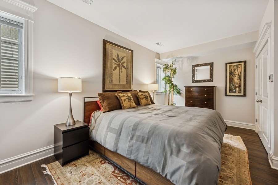 1025 Mohawk Road Wilmette, IL 60091 - Photo 30 of 47 a bed room with a bed and a night stand