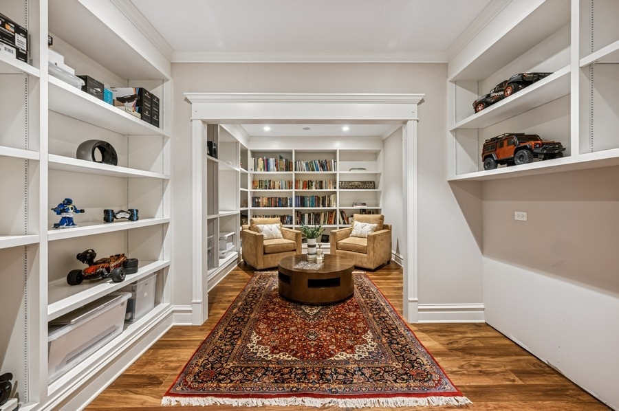 1025 Mohawk Road Wilmette, IL 60091 - Photo 33 of 47 a living room with furniture and a book shelf
