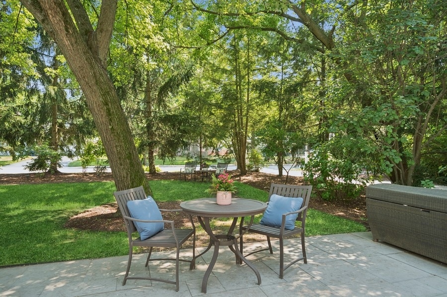 1025 Mohawk Road Wilmette, IL 60091 - Photo 40 of 47 a view of a table and chairs in backyard of the house