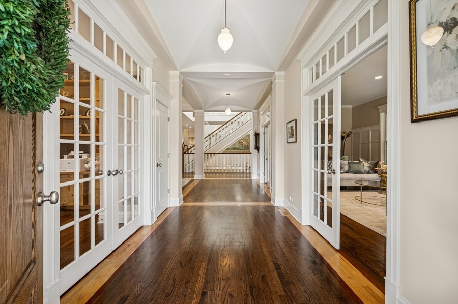 1025 Mohawk Road Wilmette, IL 60091 - Photo 4 of 47 a view of a hallway with wooden floor and staircase