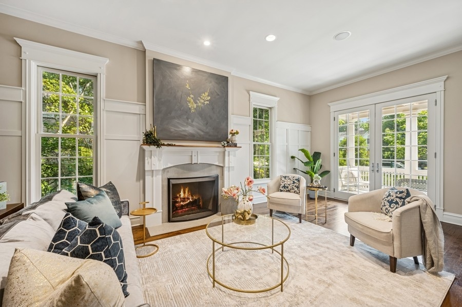 1025 Mohawk Road Wilmette, IL 60091 - Photo 7 of 47 a living room with furniture and a fireplace