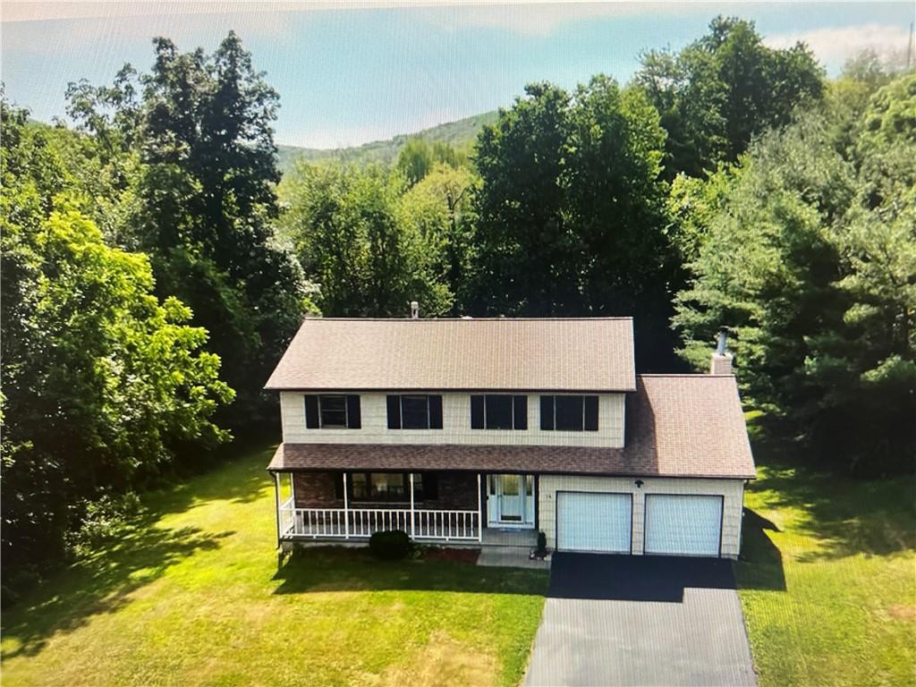 an aerial view of a house with swimming pool