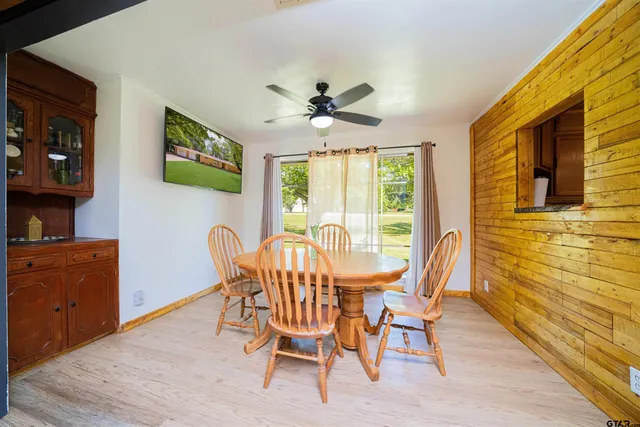 a dining room with furniture and window
