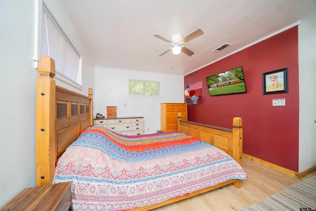 a bedroom with bed and a window