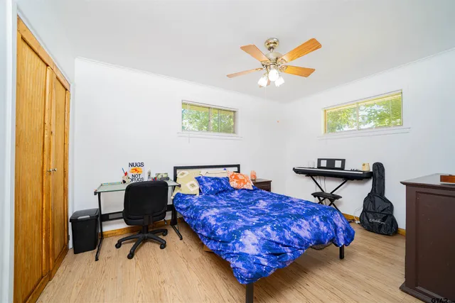 a living room with a bed and furniture