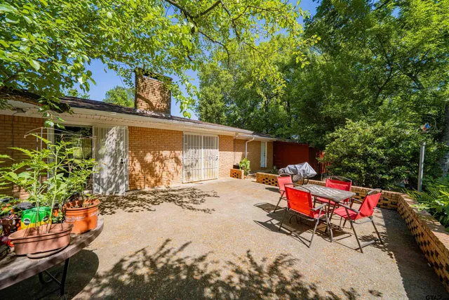 an outdoor space with lounge chair