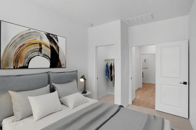 a bedroom with a bed and window