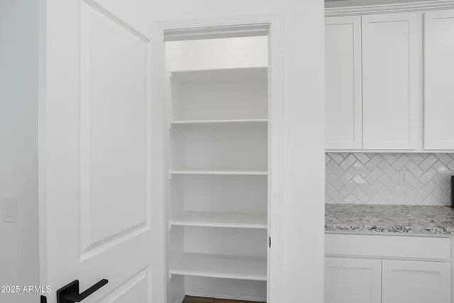 a view of an empty walk in closet