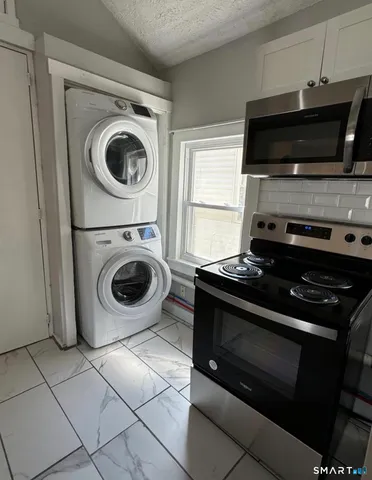 a view of kitchen and microwave